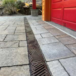 Decorative cast iron trench grates with southwest influenced Thunderbird pattern