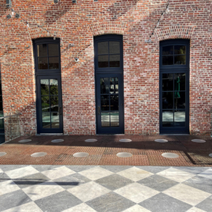 Pedestrian bridge made from decorative cast iron panels with light holes.