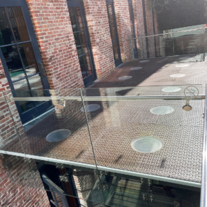 Pedestrian bridge made from decorative cast iron panels with light holes.