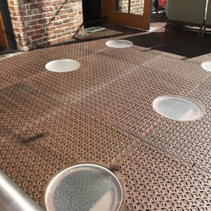 Pedestrian bridge made from decorative cast iron panels with light holes.