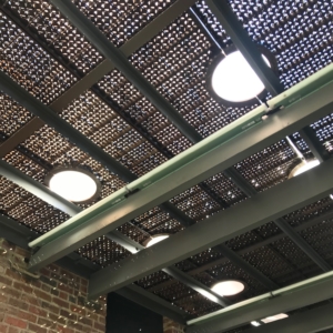 Pedestrian bridge made from decorative cast iron panels with light holes.