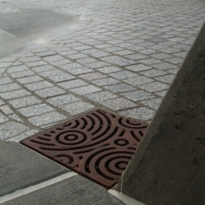 Decorative cast iron drain grate in Oblio pattern