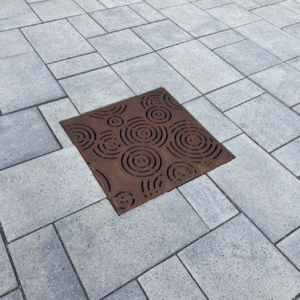 Decorative cast iron drain grate in Oblio pattern