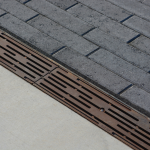 Decorative cast iron trench grate in Rain pattern