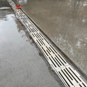 Cast aluminum decorative trench grate installed in entry plaza to Climate Pledge Arena