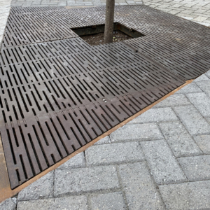 Decorative cast iron tree grate with Rain pattern