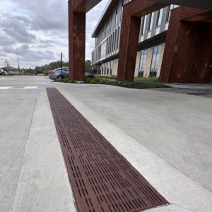 Decorative cast iron trench grate in Rain pattern