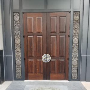 Entry doors with rose themed cast bronze door pulls and side panels