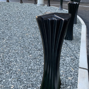 Decorative cast aluminum bollard with powder coat finish and unique geometric relief