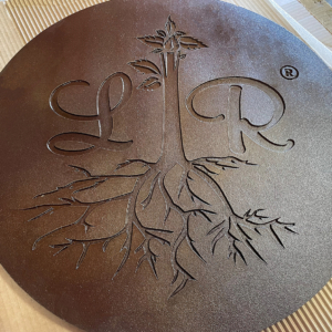 Cast iron plaque, baked-on-oil finish, with Lavish Roots catering logo