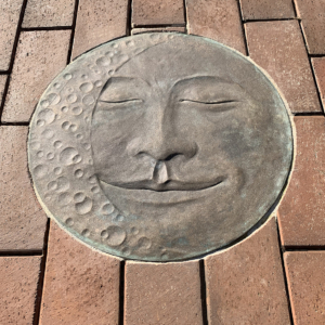 Cast bronze Moon Face embed plaque showing Waning Crescent moon face