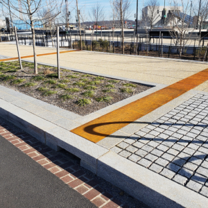 Cast iron solid utility cover with modern Urban Rhythms pattern.