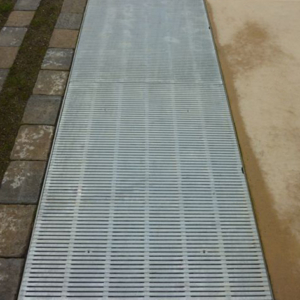 Raw cast aluminum drain grates in linear Regular Joe pattern