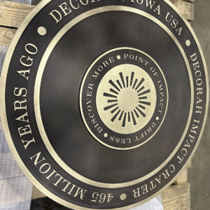 4' dia. cast bronze plaque with patina finish. 18" changeable center insert.